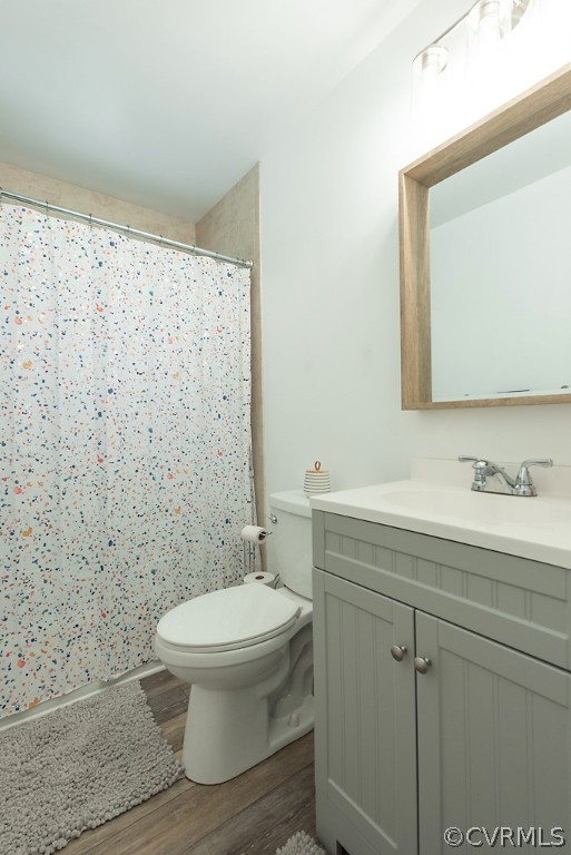 3825 Frankmont Road Richmond, VA 23234 - Photo 36 of 47 a bathroom with a granite countertop toilet a sink a mirror and a shower