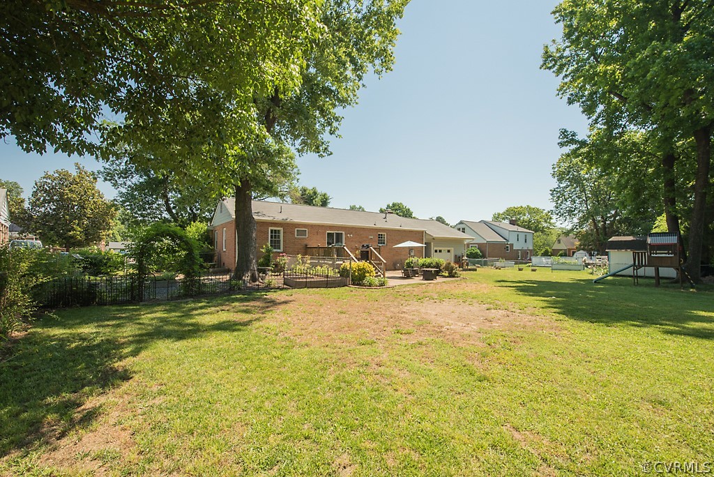 3825 Frankmont Road Richmond, VA 23234 - Photo 45 of 47 a front view of a house with a garden and trees