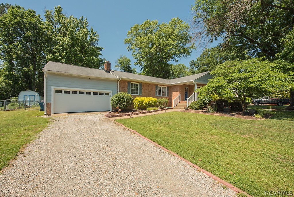 3825 Frankmont Road Richmond, VA 23234 - Photo 47 of 47 a front view of a house with yard and trees