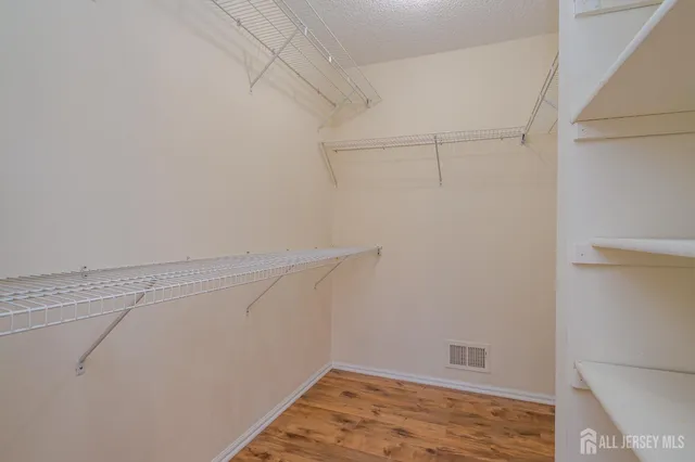 a view of a room with racks on the wall