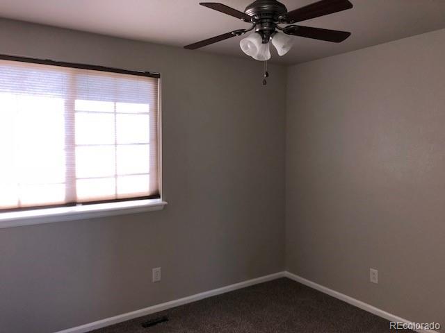 19917 Mitchell Circle Denver, CO 80249 - Photo 11 of 13 an empty room with a window