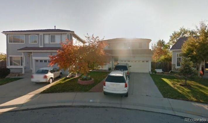 19917 Mitchell Circle Denver, CO 80249 - Photo 12 of 13 a view of a street that has couple of cars parked on road