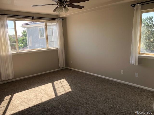 19917 Mitchell Circle Denver, CO 80249 - Photo 7 of 13 an empty room with a window