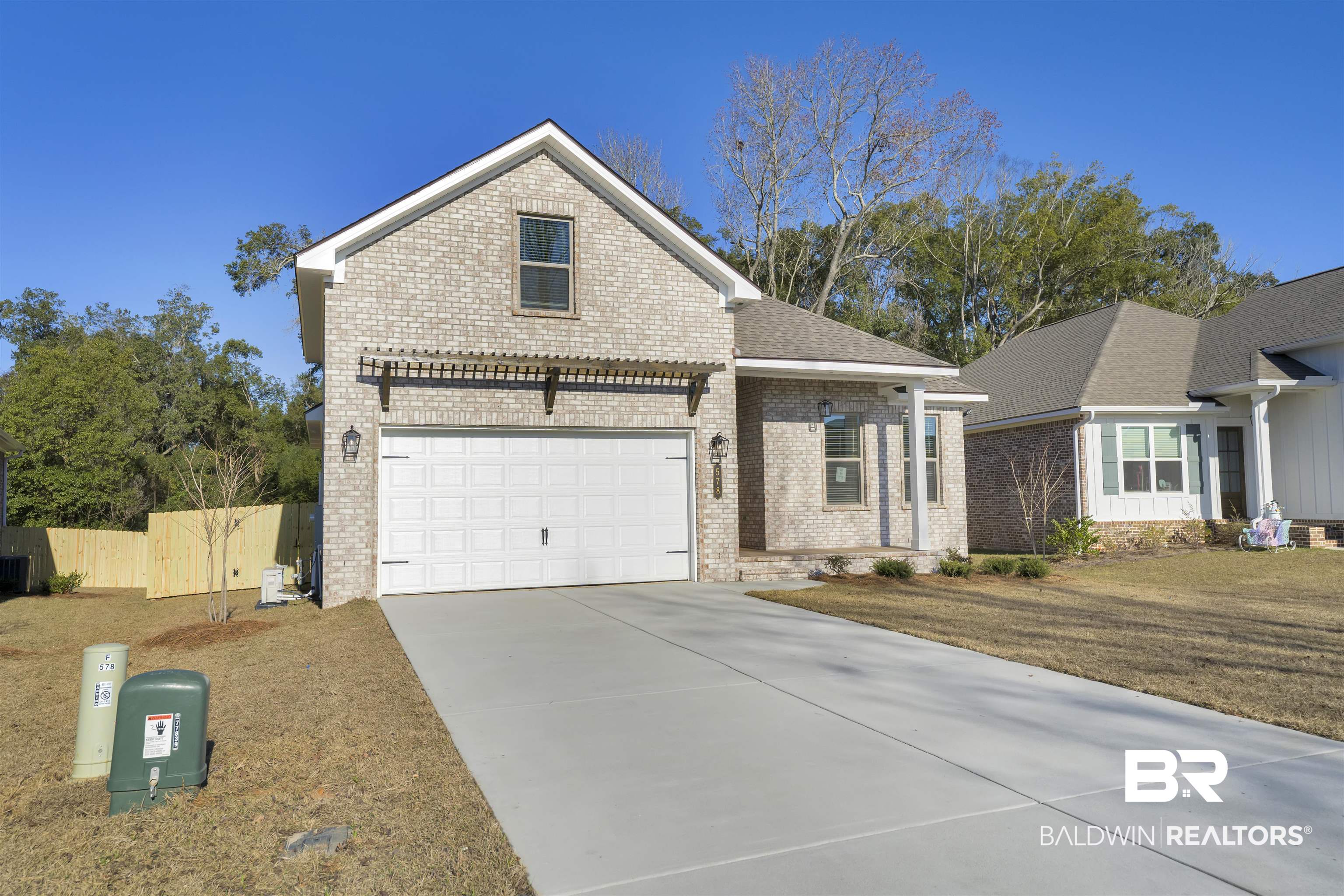 571 Morning Mist Way Fairhope, AL 36532 - Photo 40 of 47 Traditional-style home featuring brick siding, driveway, and a garage