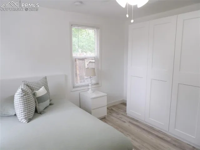 a room with a bed and a window