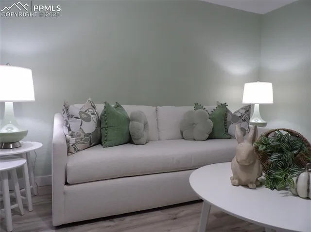 a living room with furniture and a lamp