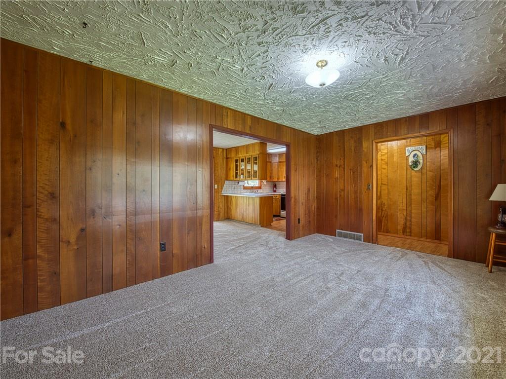 720 Iron Duff Road Waynesville, NC 28785 - Photo 12 of 37 a view of an empty room and a kitchen