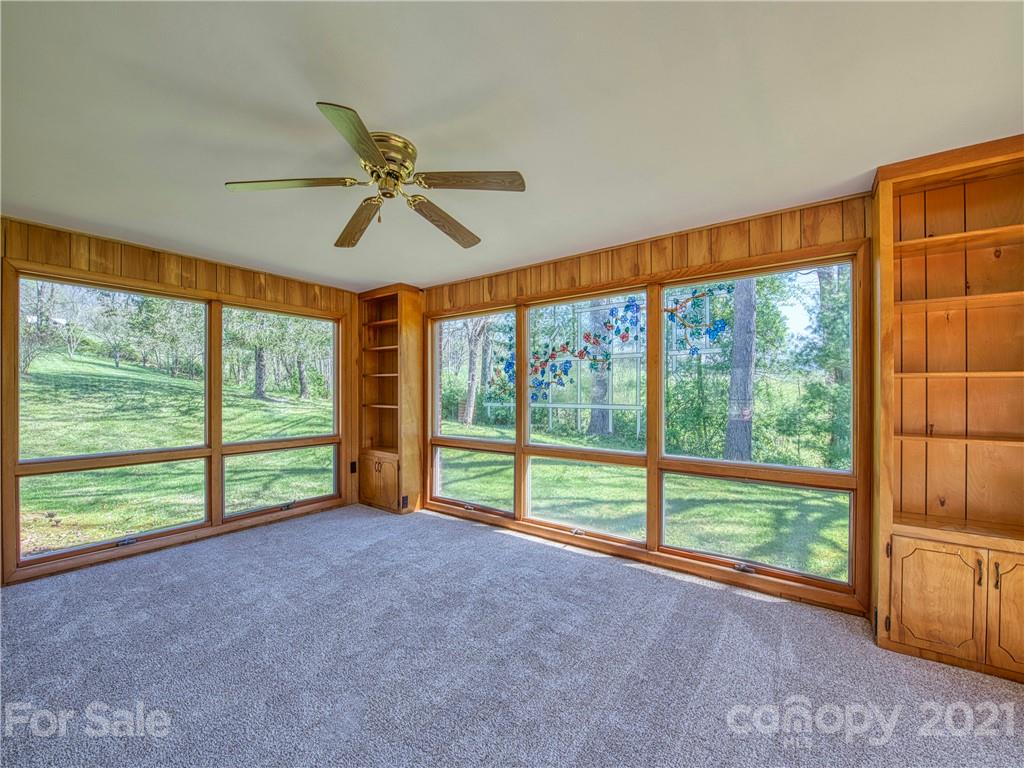 720 Iron Duff Road Waynesville, NC 28785 - Photo 15 of 37 a view of room with window and ceiling fan