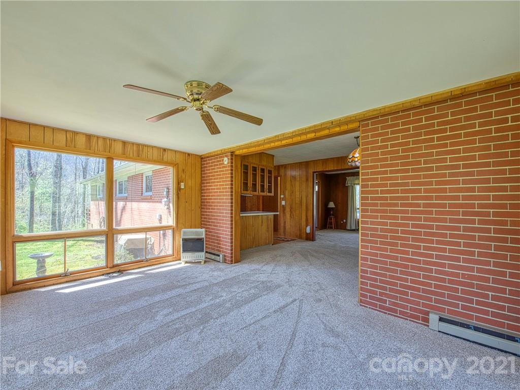 720 Iron Duff Road Waynesville, NC 28785 - Photo 16 of 37 a view of n empty room with a ceiling fan and window