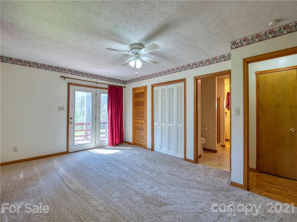 720 Iron Duff Road Waynesville, NC 28785 - Photo 20 of 37 a view of an empty room with closet area