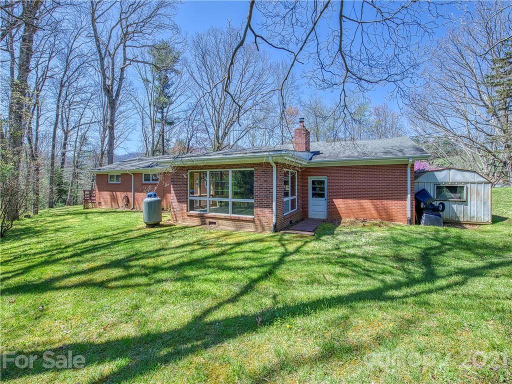 720 Iron Duff Road Waynesville, NC 28785 - Photo 3 of 37 a view of a house with a backyard