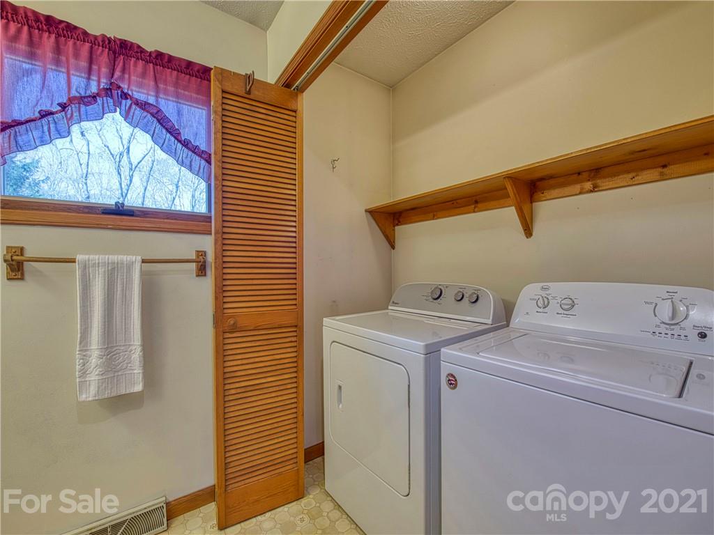 720 Iron Duff Road Waynesville, NC 28785 - Photo 24 of 37 a utility room with dryer and washer
