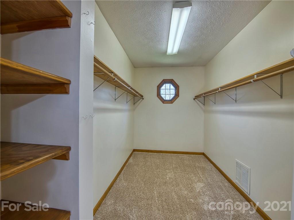 720 Iron Duff Road Waynesville, NC 28785 - Photo 25 of 37 a view of a hallway with window