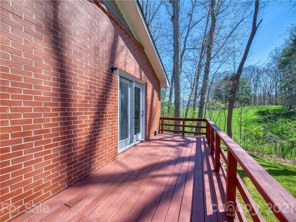 720 Iron Duff Road Waynesville, NC 28785 - Photo 27 of 37 a view of balcony with deck and wooden floor