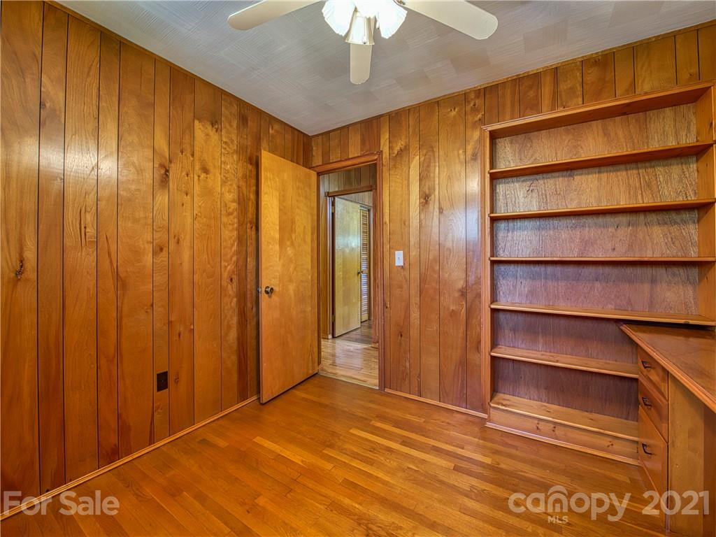 720 Iron Duff Road Waynesville, NC 28785 - Photo 29 of 37 a view of an empty room with a fireplace and a window