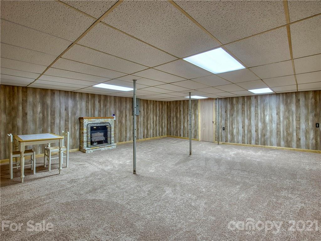 720 Iron Duff Road Waynesville, NC 28785 - Photo 35 of 37 a view of an empty room with a fireplace
