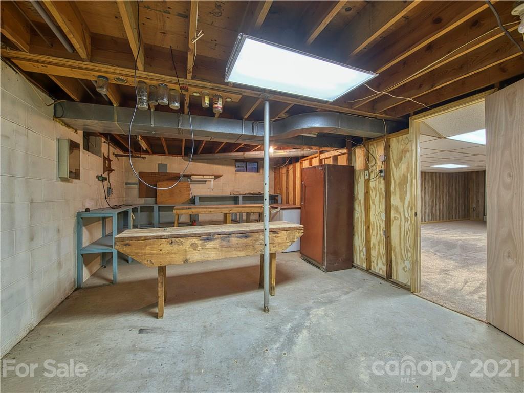 720 Iron Duff Road Waynesville, NC 28785 - Photo 37 of 37 a view of an empty room with wooden walls