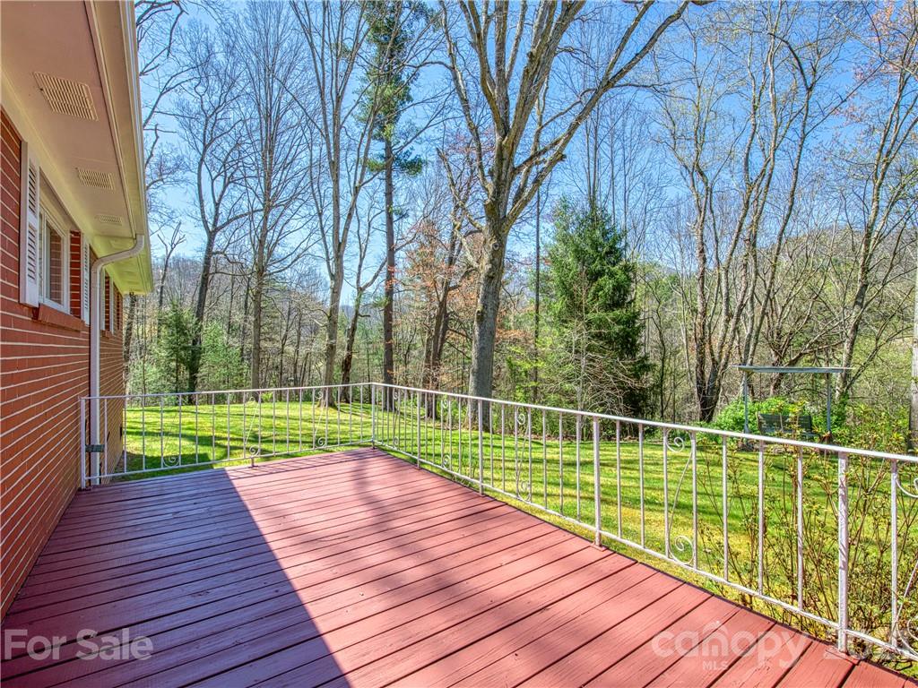 720 Iron Duff Road Waynesville, NC 28785 - Photo 5 of 37 a view of wooden deck with a wooden floor and fence