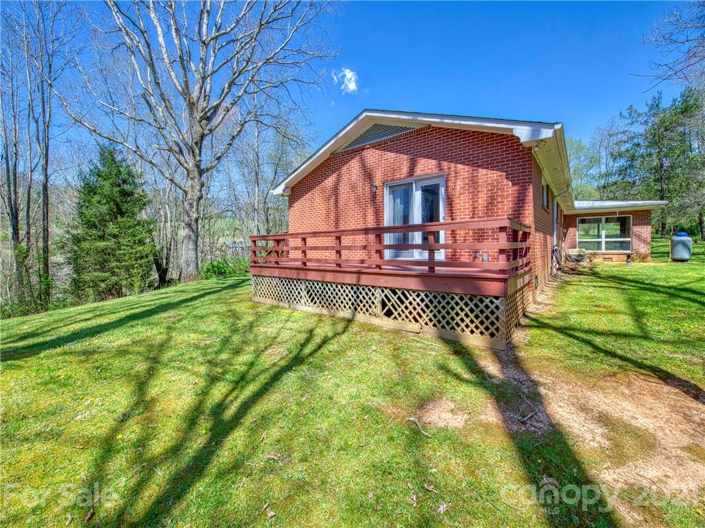 720 Iron Duff Road Waynesville, NC 28785 - Photo 6 of 37 a view of house with a yard