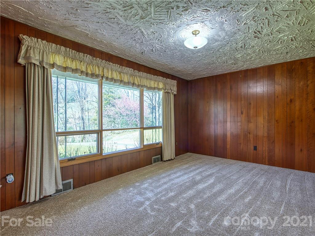 720 Iron Duff Road Waynesville, NC 28785 - Photo 10 of 37 a view of an empty room with a window
