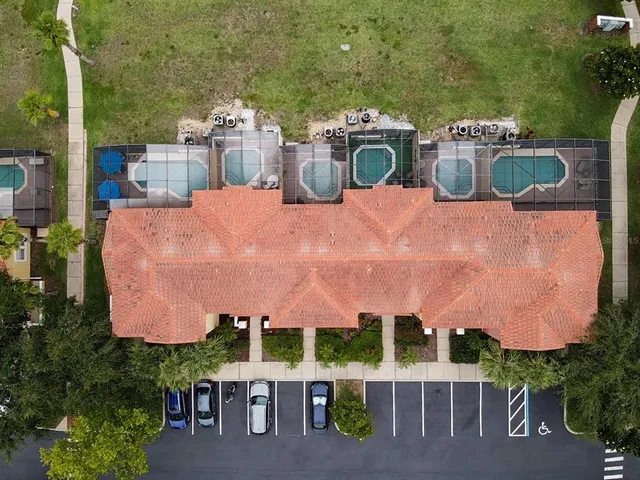 a view of a patio with table and chairs potted plants