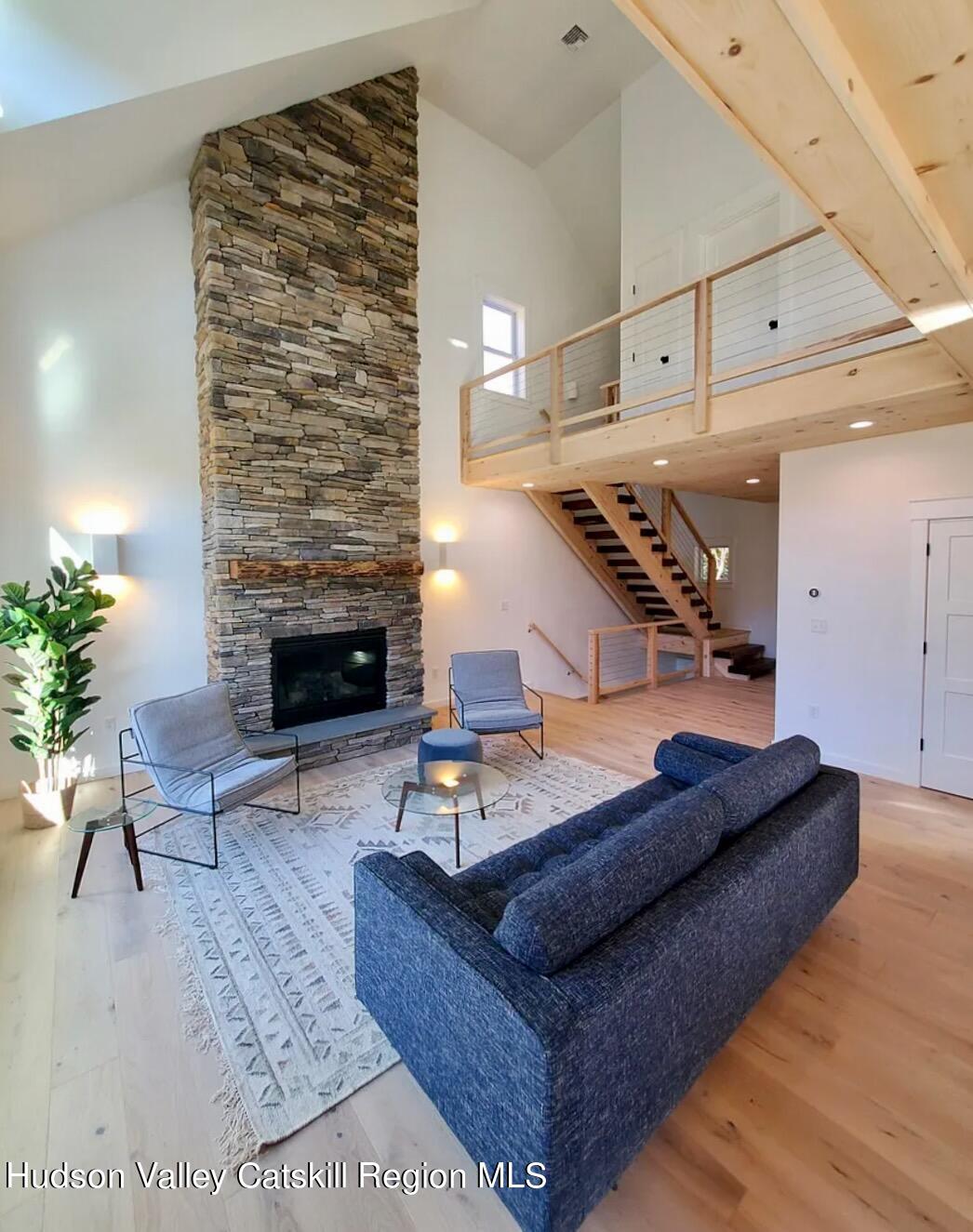 382 Beaverkill Road Olivebridge, NY 12461 - Photo 11 of 40 a living room with furniture and a fireplace