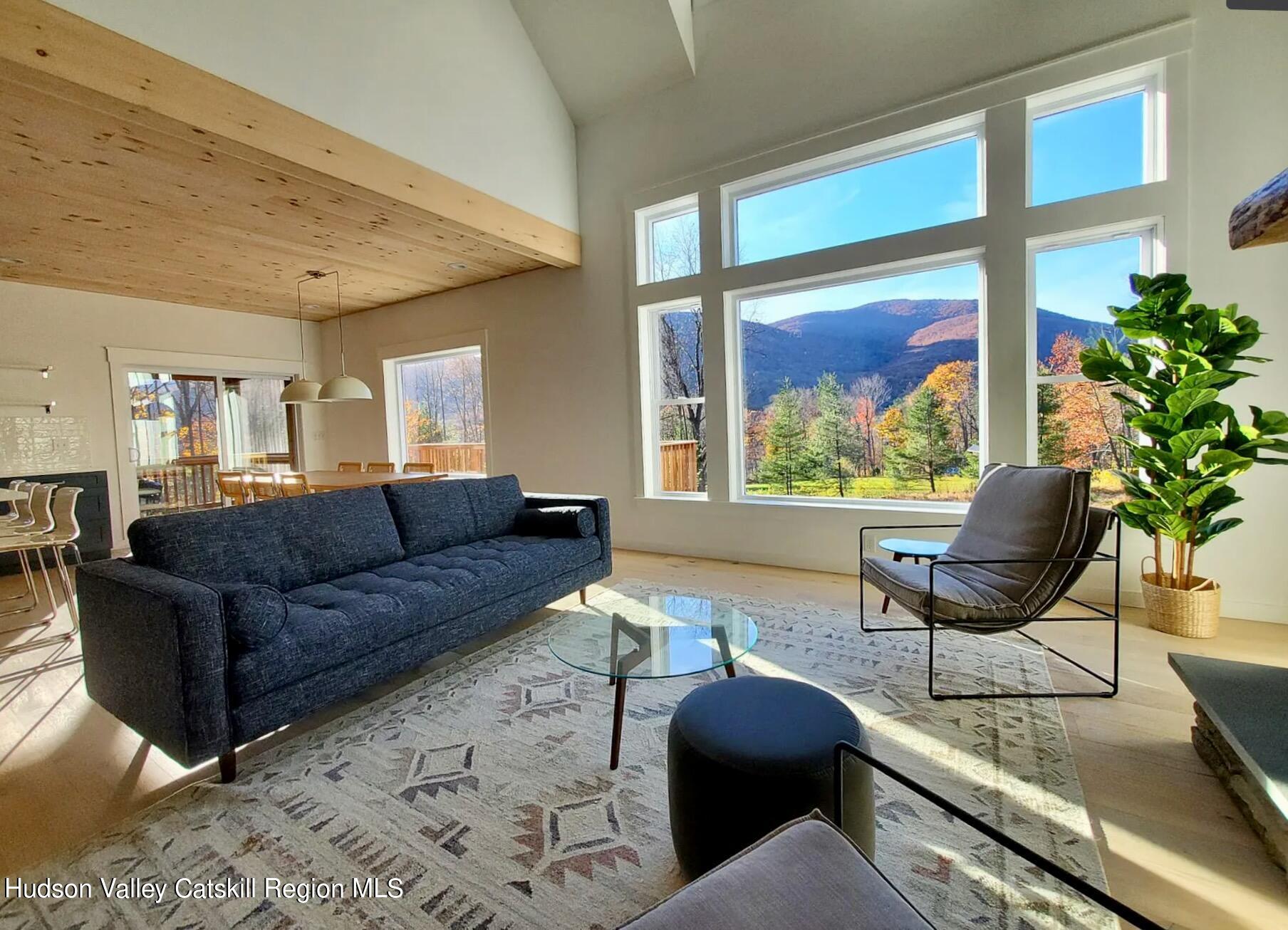 382 Beaverkill Road Olivebridge, NY 12461 - Photo 12 of 40 a living room with furniture and a large window