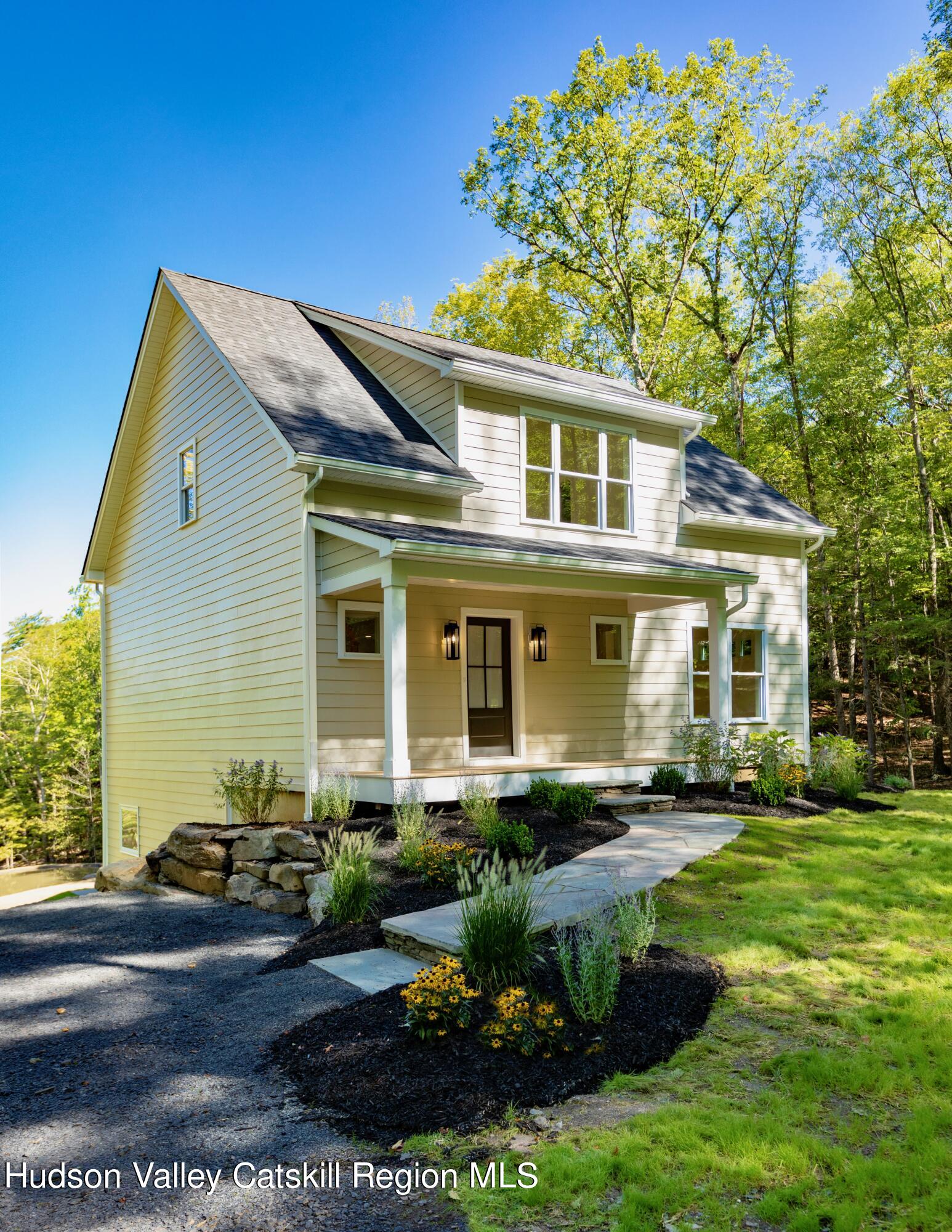 382 Beaverkill Road Olivebridge, NY 12461 - Photo 2 of 40 a front view of a house with a yard