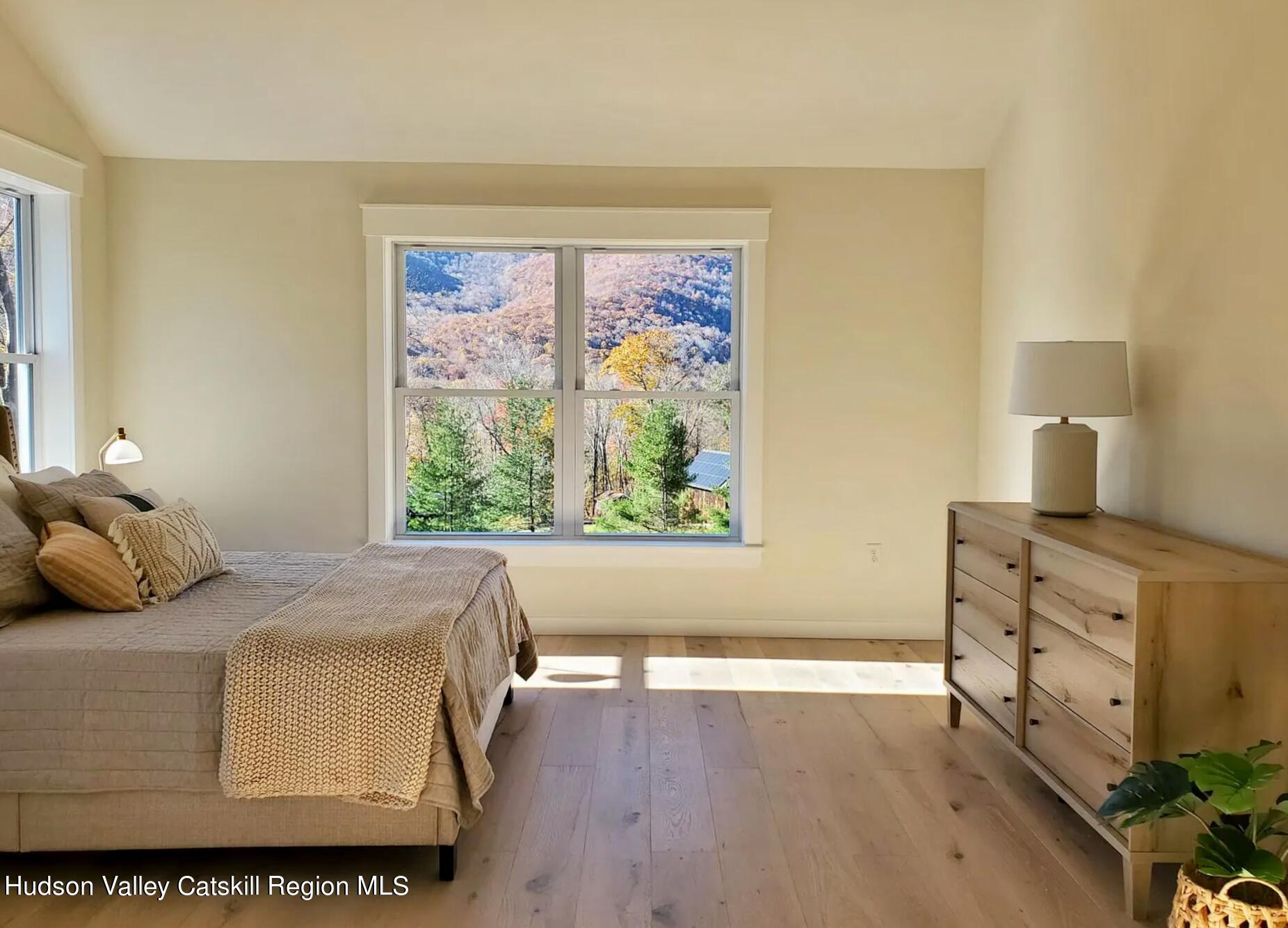 382 Beaverkill Road Olivebridge, NY 12461 - Photo 21 of 40 a bedroom with furniture and a window