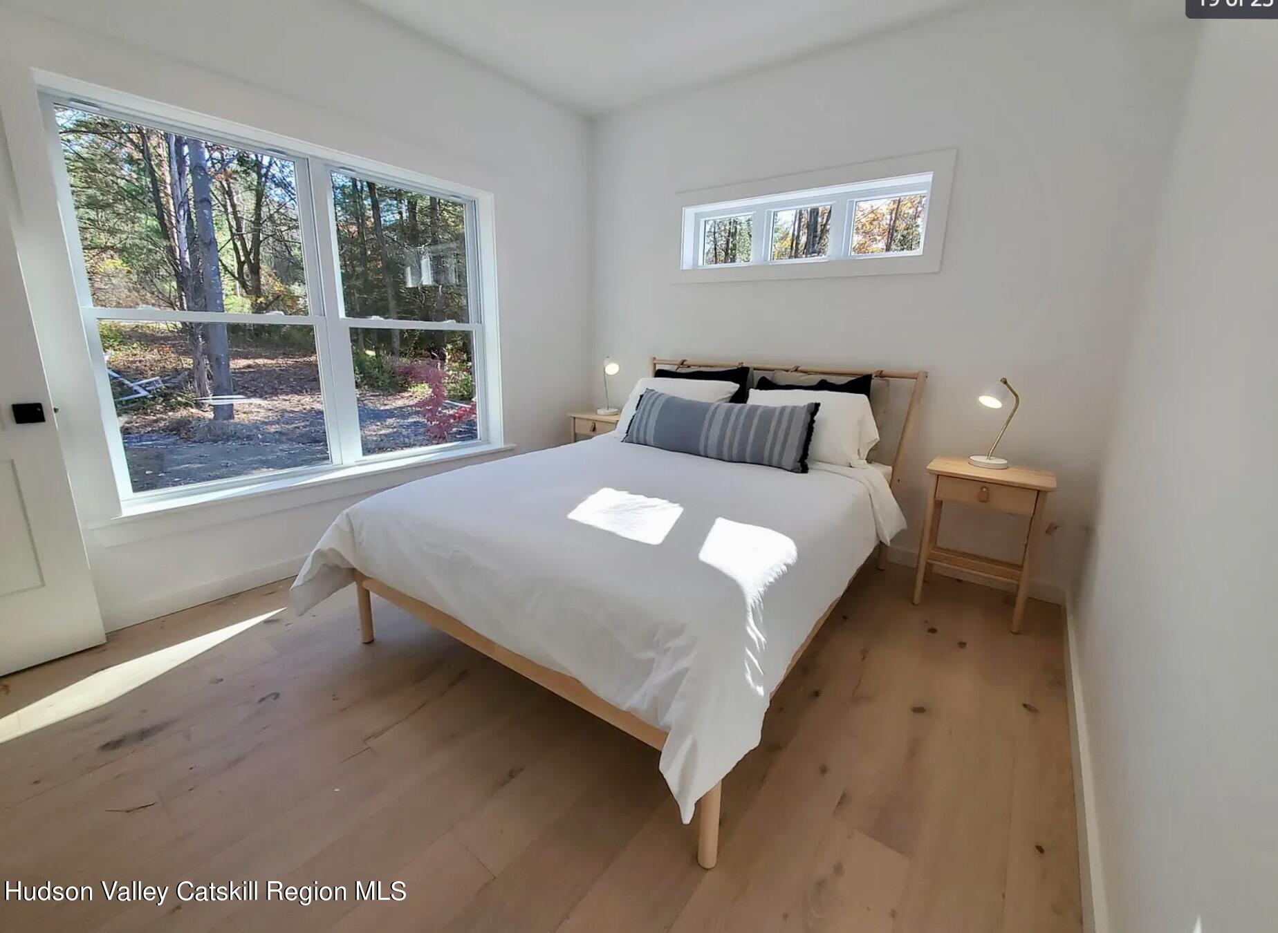 382 Beaverkill Road Olivebridge, NY 12461 - Photo 22 of 40 a large bed sitting in a bedroom next to a window