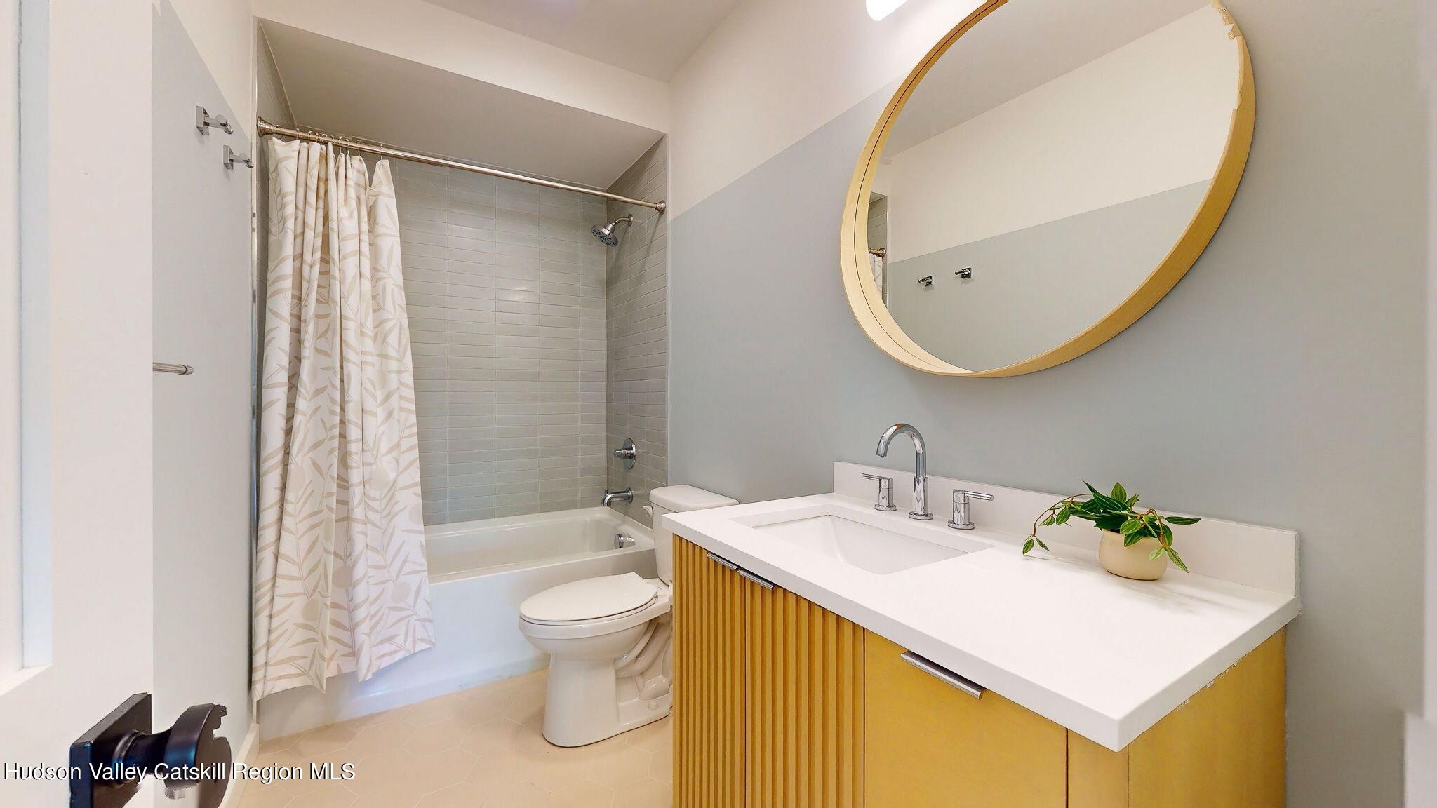 382 Beaverkill Road Olivebridge, NY 12461 - Photo 25 of 40 a bathroom with a sink a toilet and a mirror