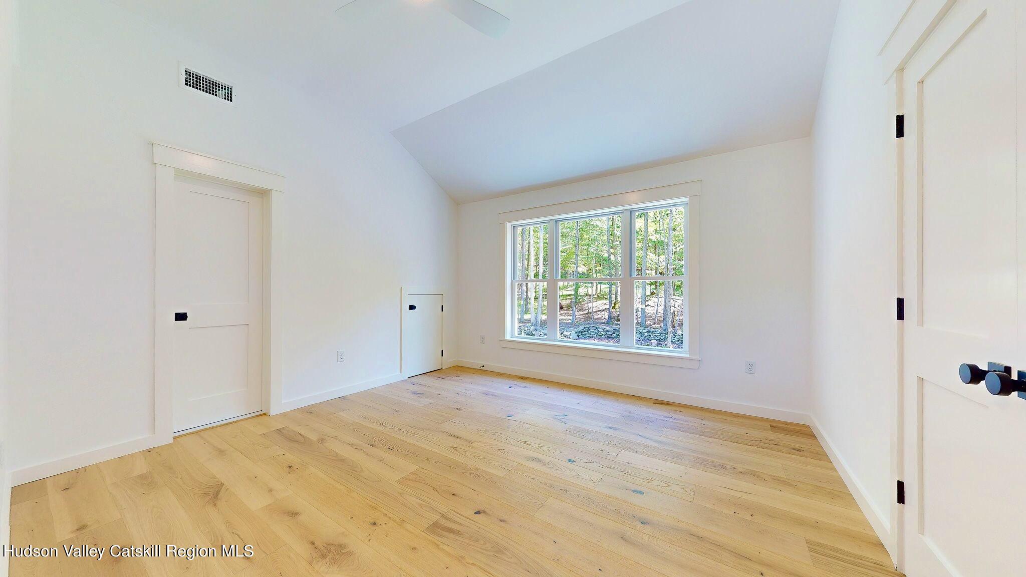 382 Beaverkill Road Olivebridge, NY 12461 - Photo 27 of 40 a view of an empty room with wooden floor and a window