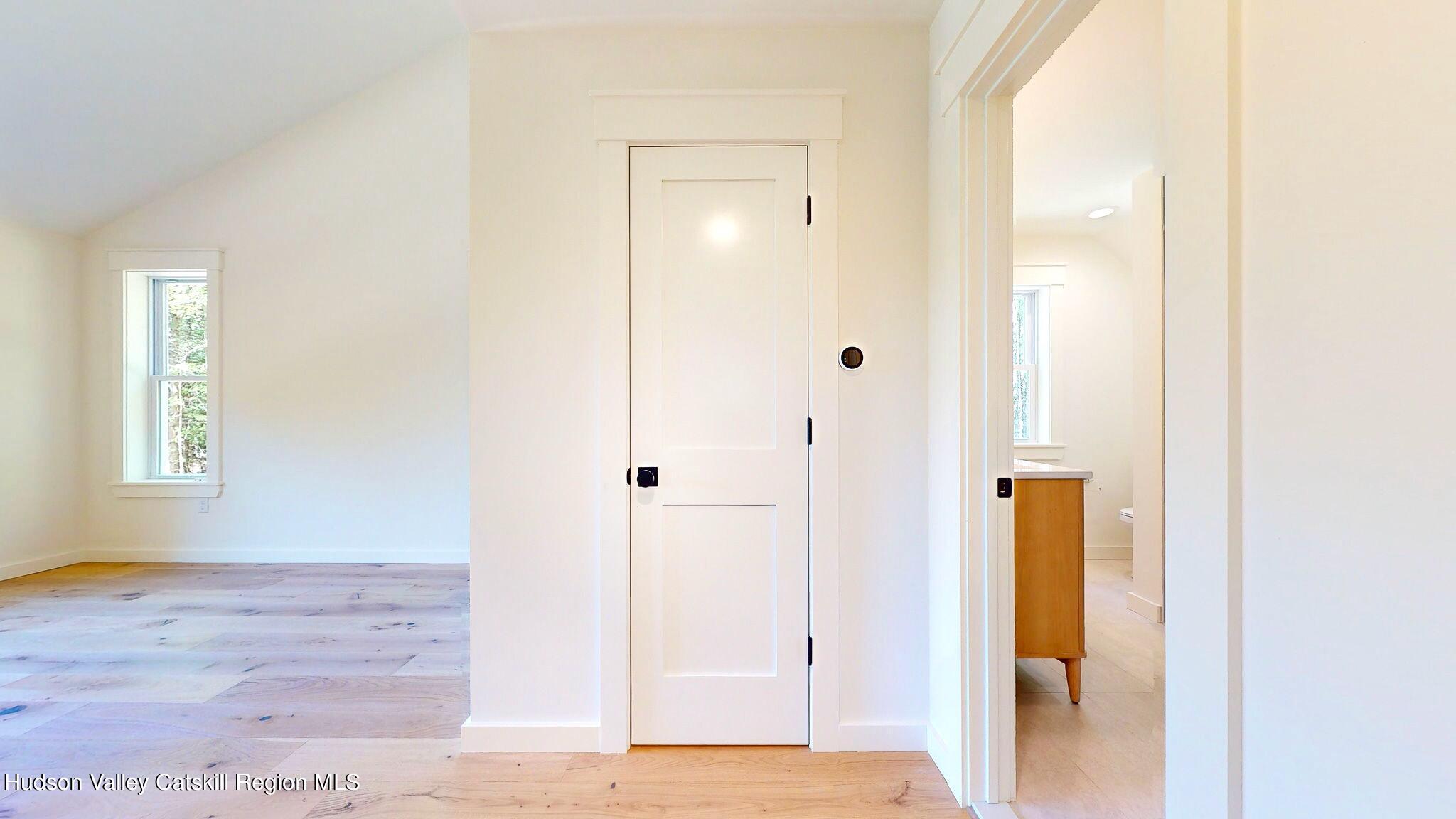 382 Beaverkill Road Olivebridge, NY 12461 - Photo 28 of 40 a view of a hallway with wooden floor and closet