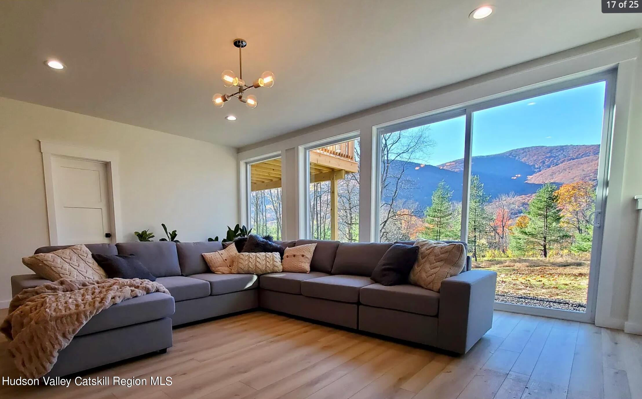 382 Beaverkill Road Olivebridge, NY 12461 - Photo 29 of 40 a living room with furniture and a large window
