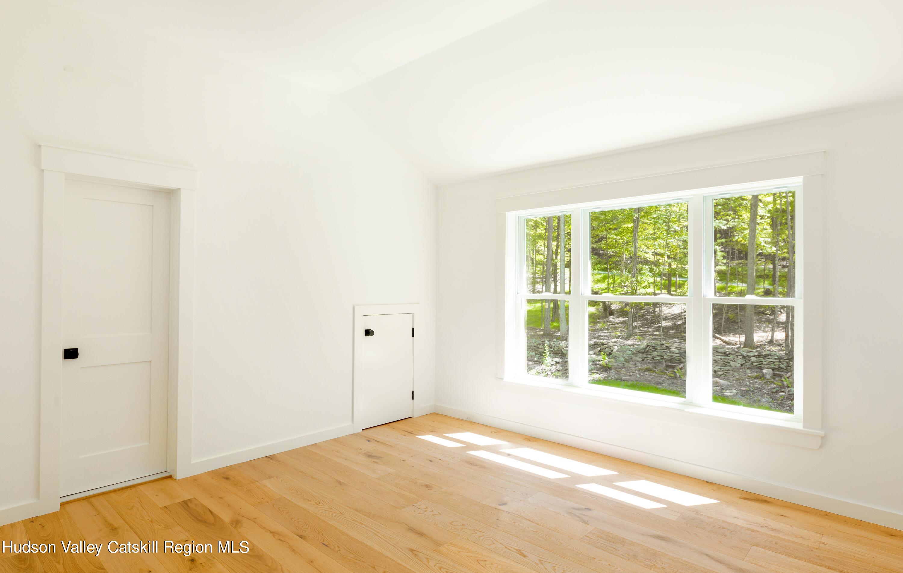 382 Beaverkill Road Olivebridge, NY 12461 - Photo 30 of 40 a view of an empty room with wooden floor and a window