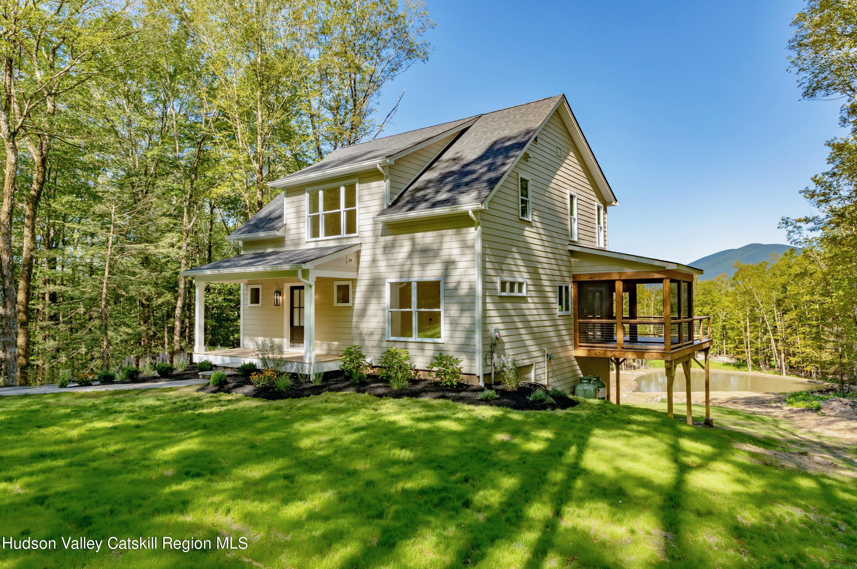 382 Beaverkill Road Olivebridge, NY 12461 - Photo 3 of 40 a front view of a house with a yard