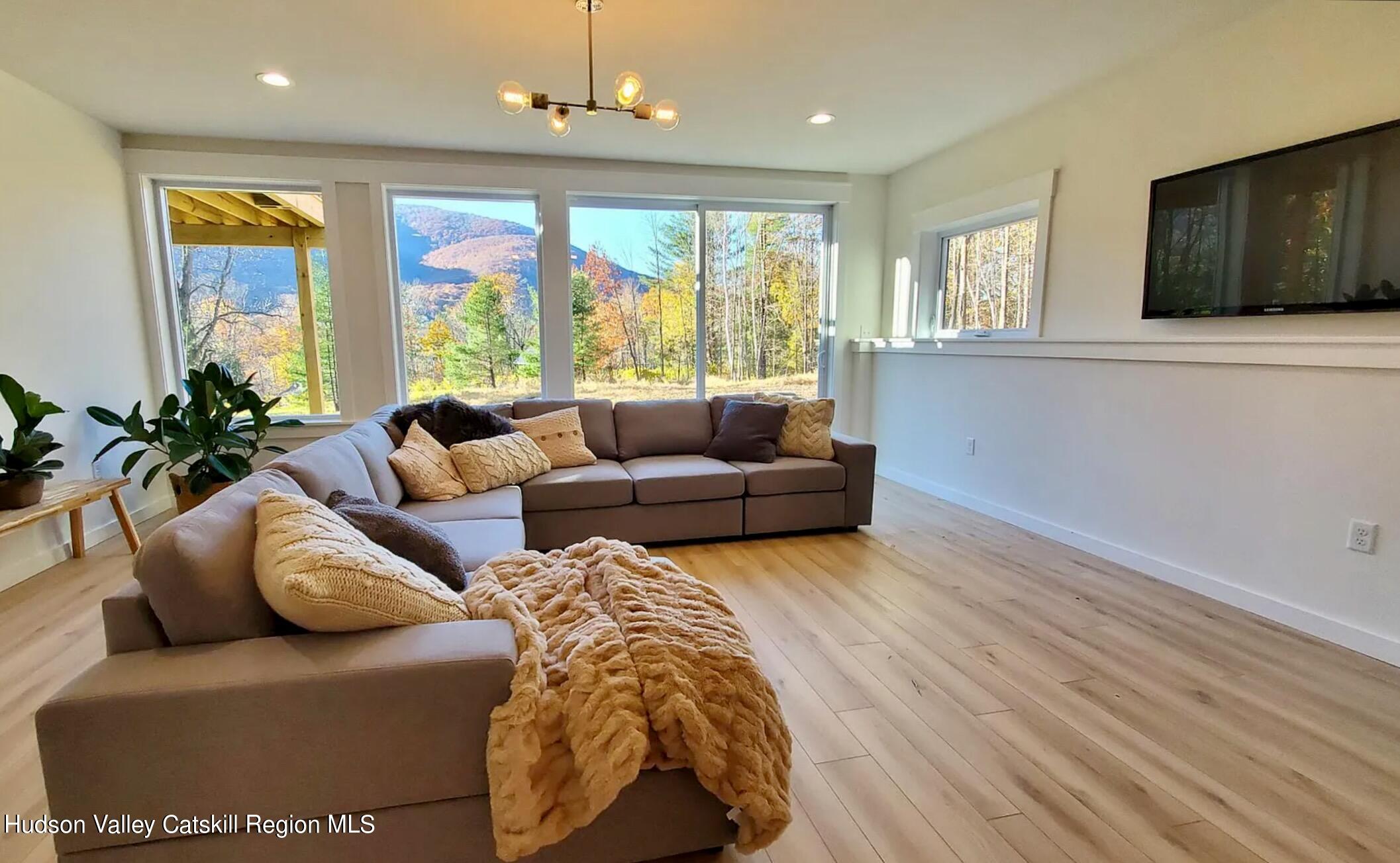 382 Beaverkill Road Olivebridge, NY 12461 - Photo 31 of 40 a living room with furniture and a flat screen tv