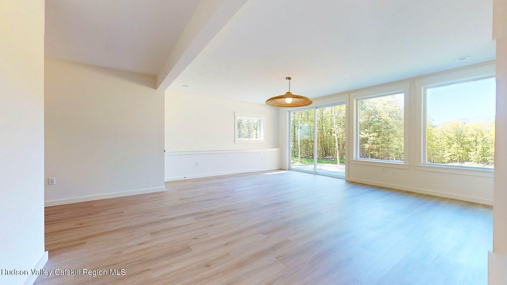 382 Beaverkill Road Olivebridge, NY 12461 - Photo 33 of 40 a view of an empty room with wooden floor and a window