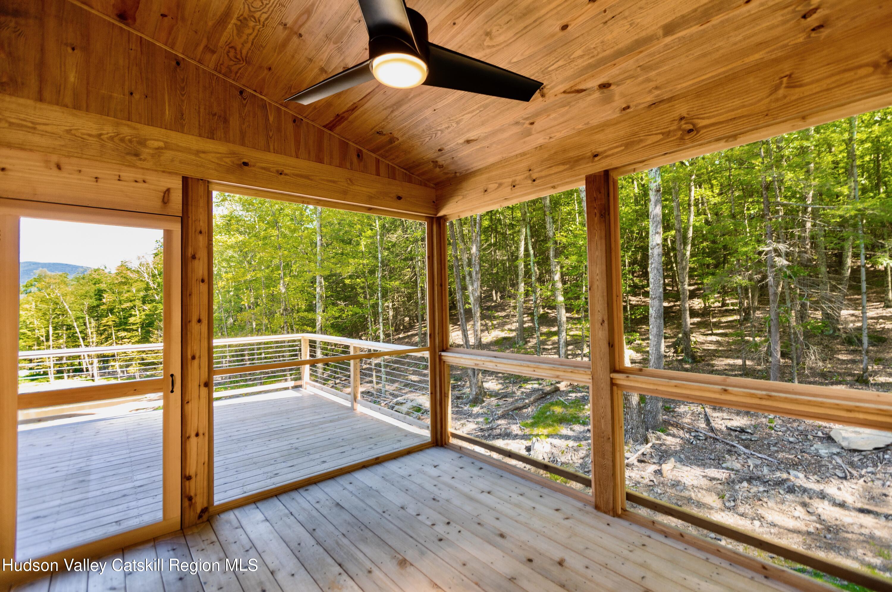 382 Beaverkill Road Olivebridge, NY 12461 - Photo 37 of 40 a view of a room with wooden floor and iron stairs