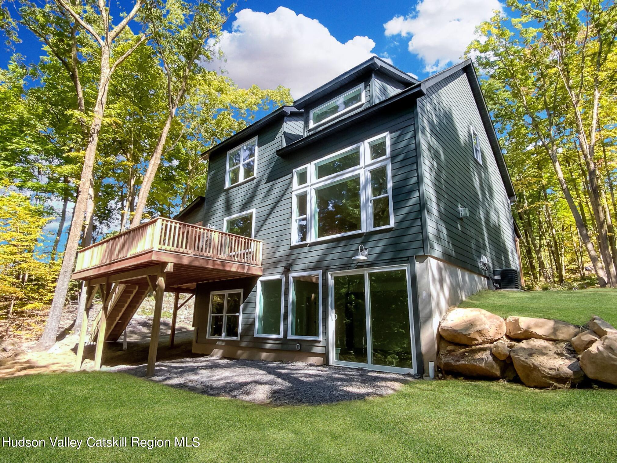 382 Beaverkill Road Olivebridge, NY 12461 - Photo 39 of 40 a view of a house with a yard and sitting area