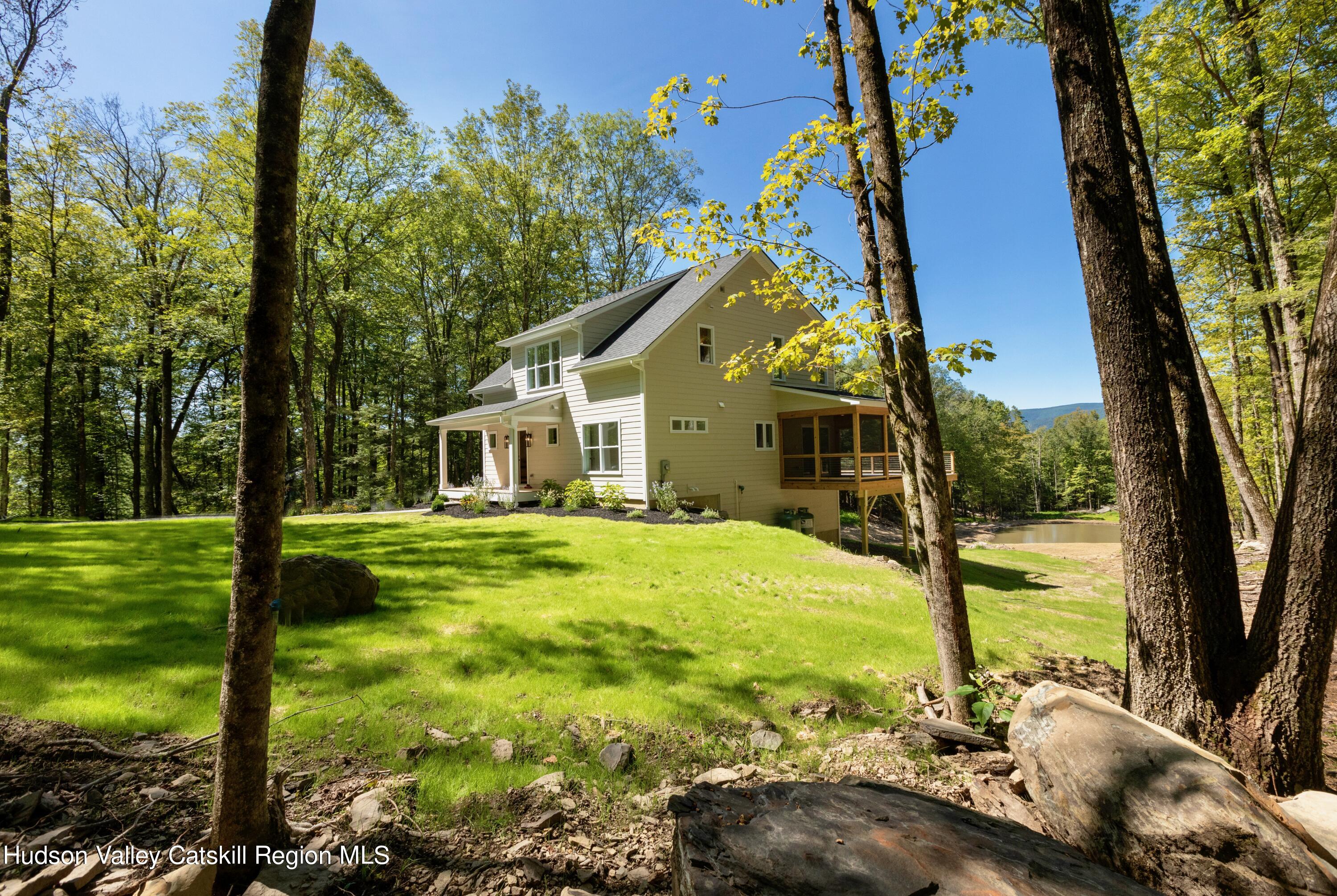 382 Beaverkill Road Olivebridge, NY 12461 - Photo 40 of 40 a view of a house with a yard patio and swimming pool