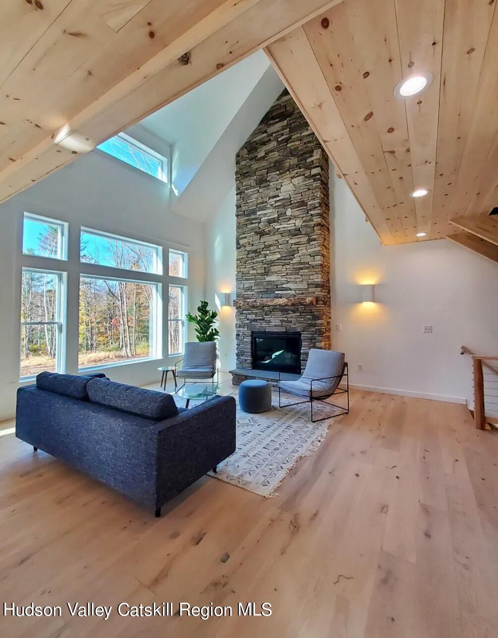 382 Beaverkill Road Olivebridge, NY 12461 - Photo 10 of 40 a living room with furniture and a fireplace