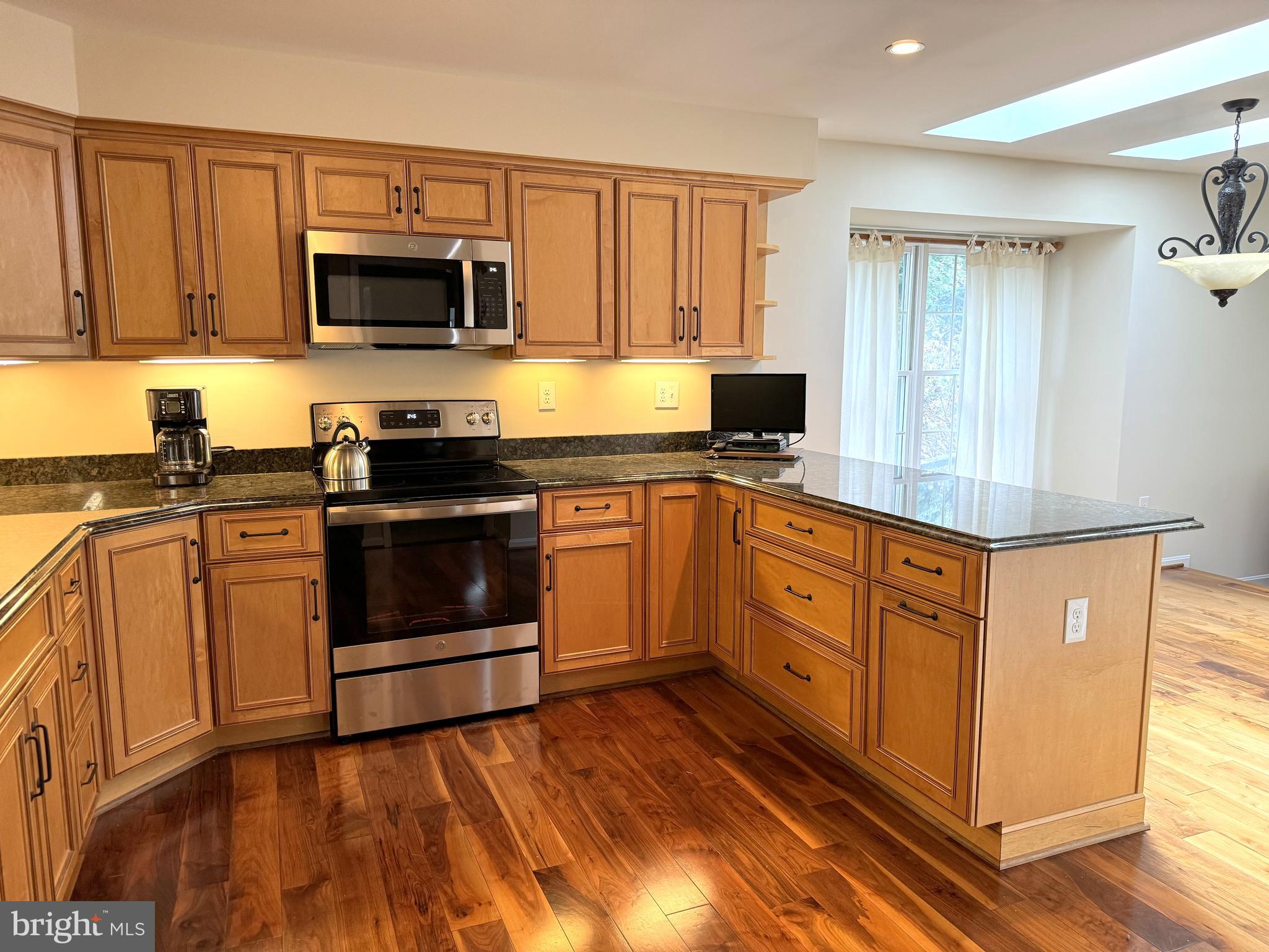 7413 Miller Fall Road Rockville, MD 20855 - Photo 18 of 63 Kitchen with peninsula adjacent to dining area