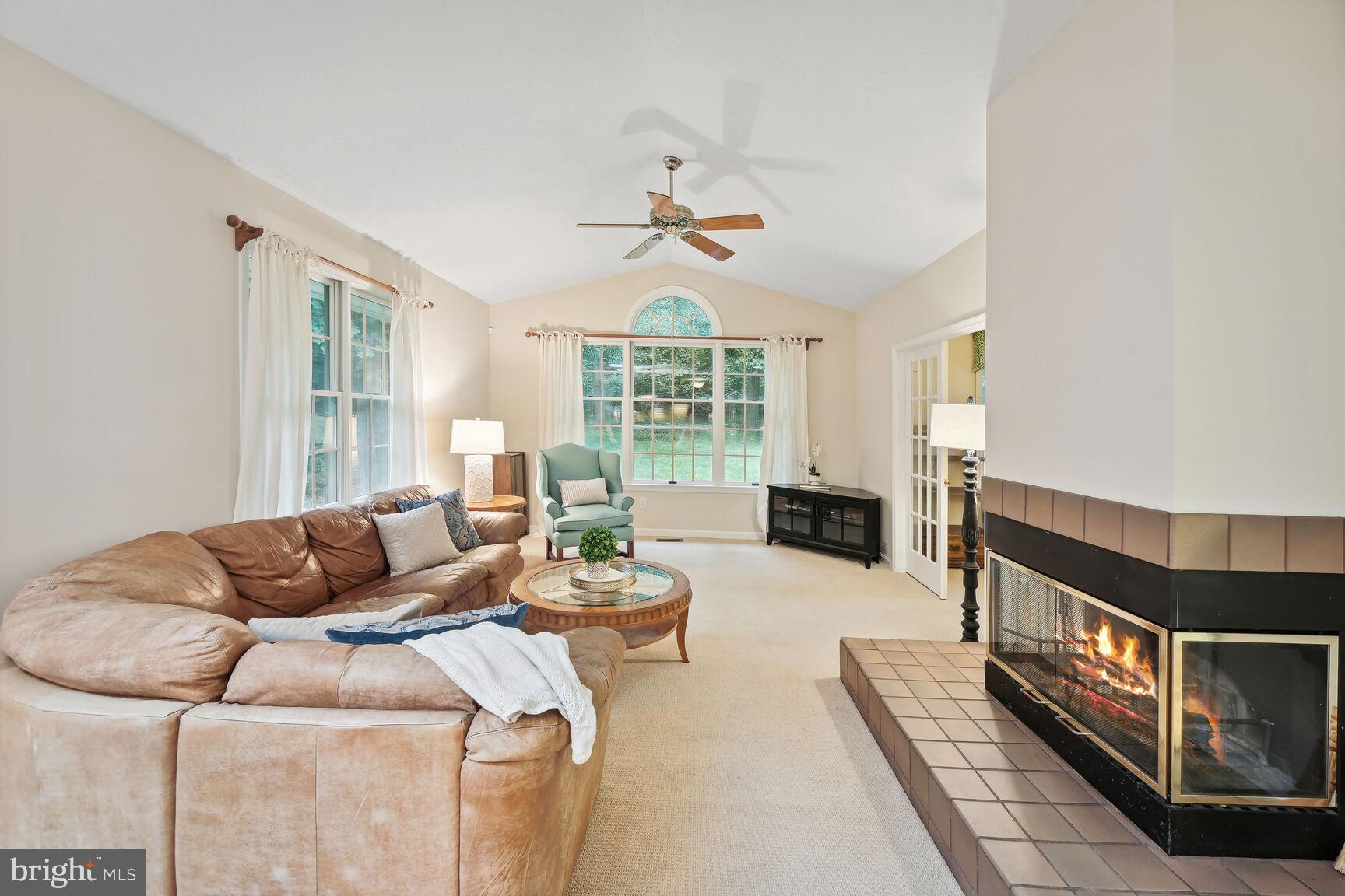 7413 Miller Fall Road Rockville, MD 20855 - Photo 21 of 63 Famly room with high ceiling and fan