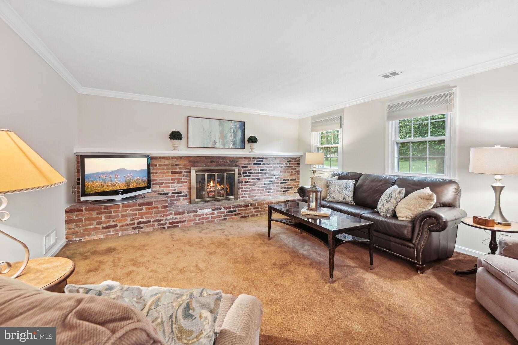 7413 Miller Fall Road Rockville, MD 20855 - Photo 30 of 63 Family room with gas fireplace