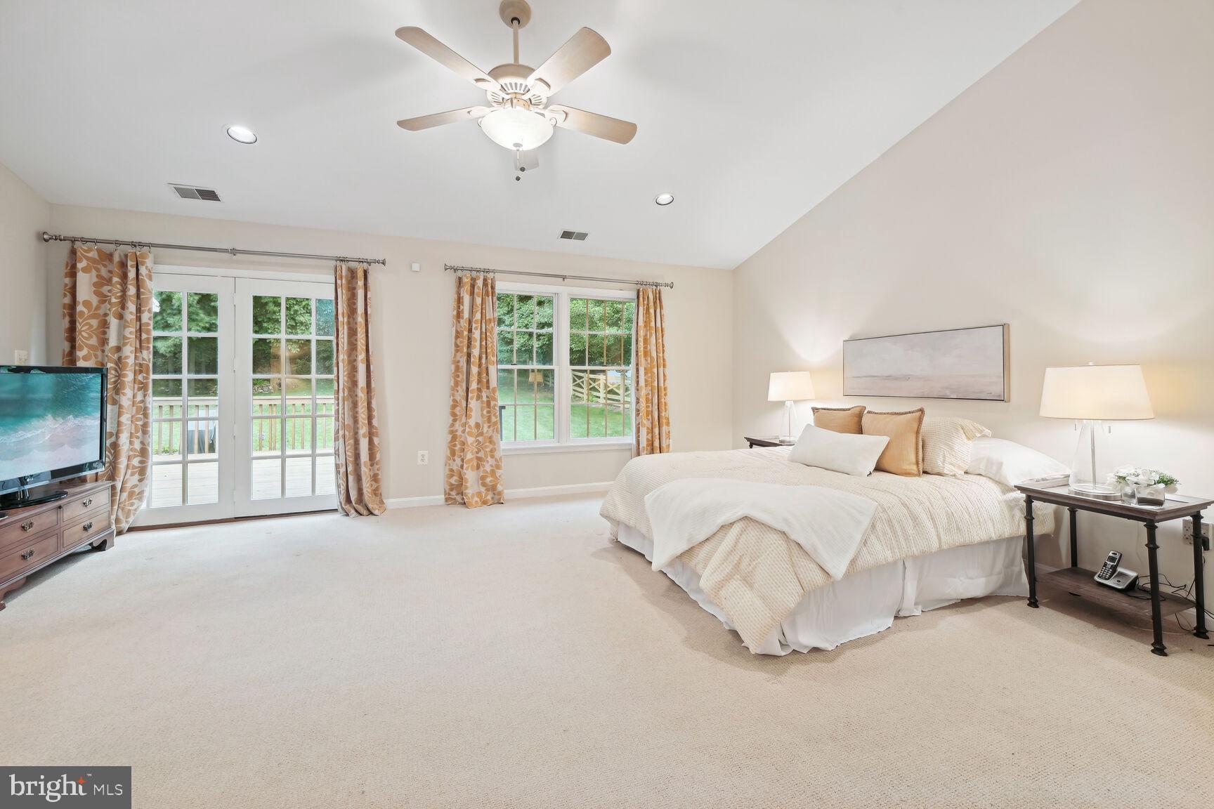 7413 Miller Fall Road Rockville, MD 20855 - Photo 32 of 63 Stunning primary suite with french door to deck