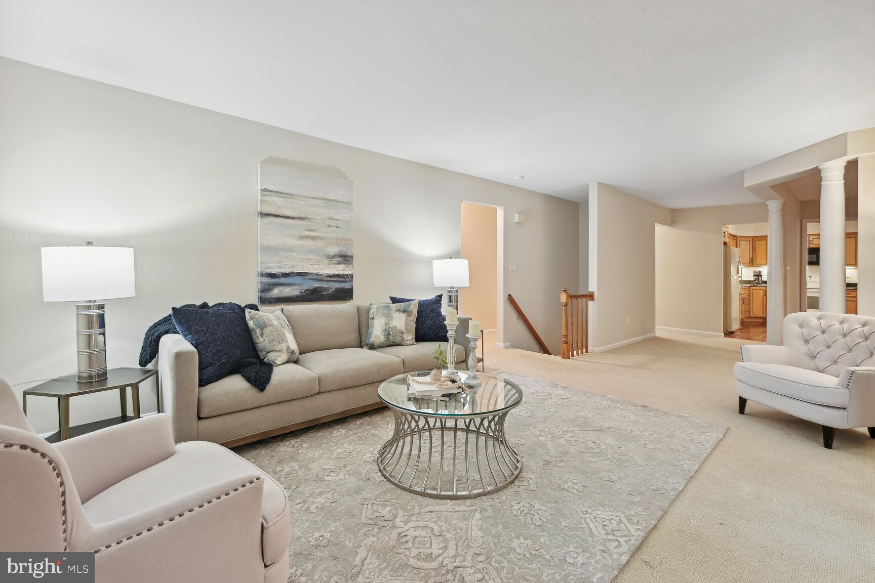 7413 Miller Fall Road Rockville, MD 20855 - Photo 6 of 63 Living room with wood floor under carpet