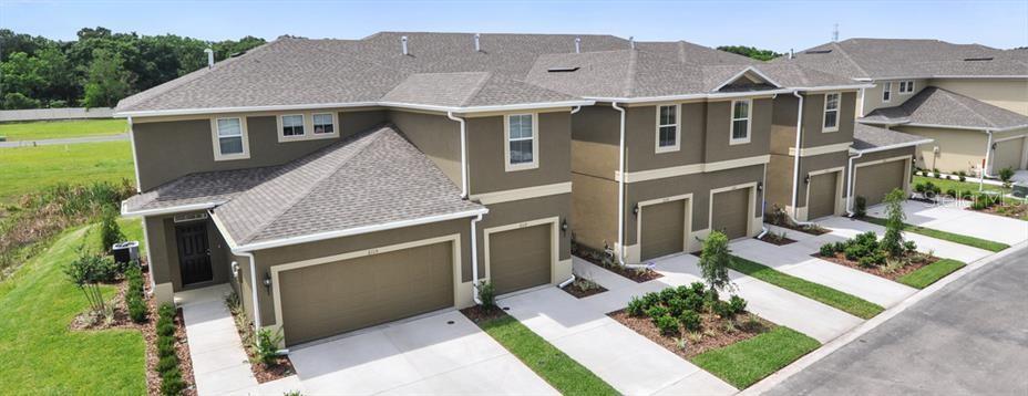 a aerial view of a house with a yard