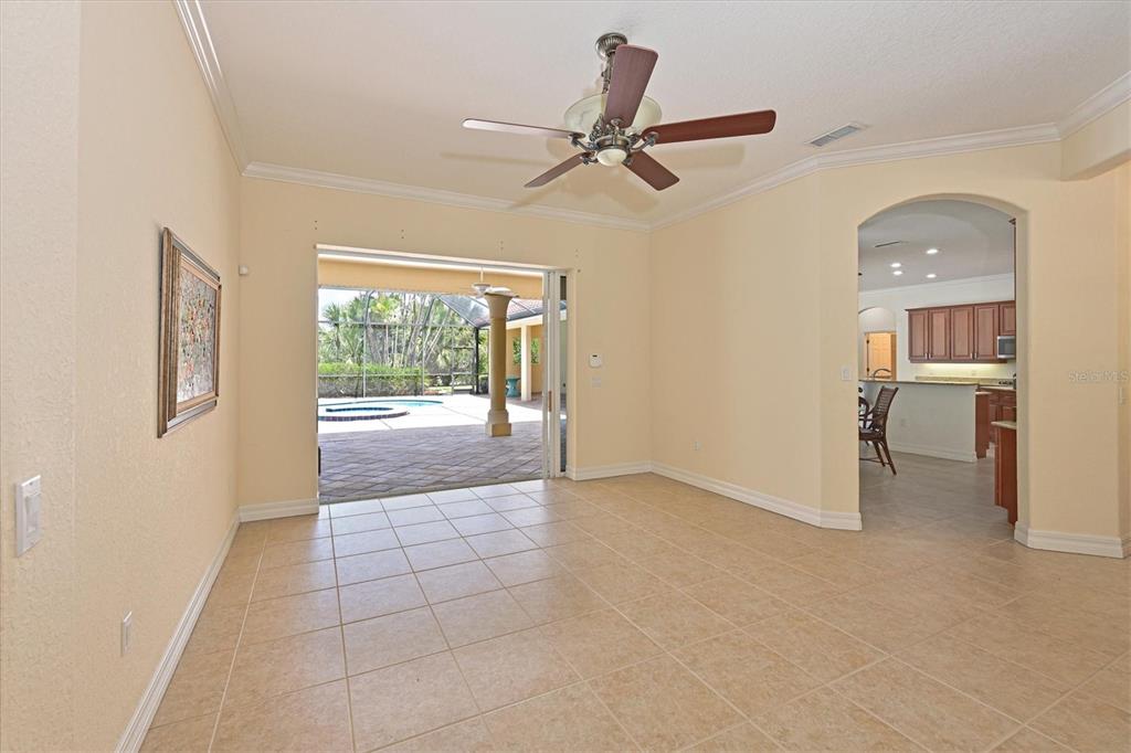 10622 Conch Shell Terrace Bradenton, FL 34212 - Photo 21 of 69 a view of a livingroom with a ceiling fan & windows