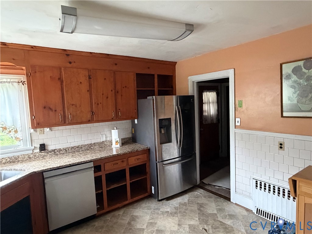 3605 Dill Road Richmond, VA 23222 - Photo 11 of 11 Kitchen space featuring wood cabinetry, white subw